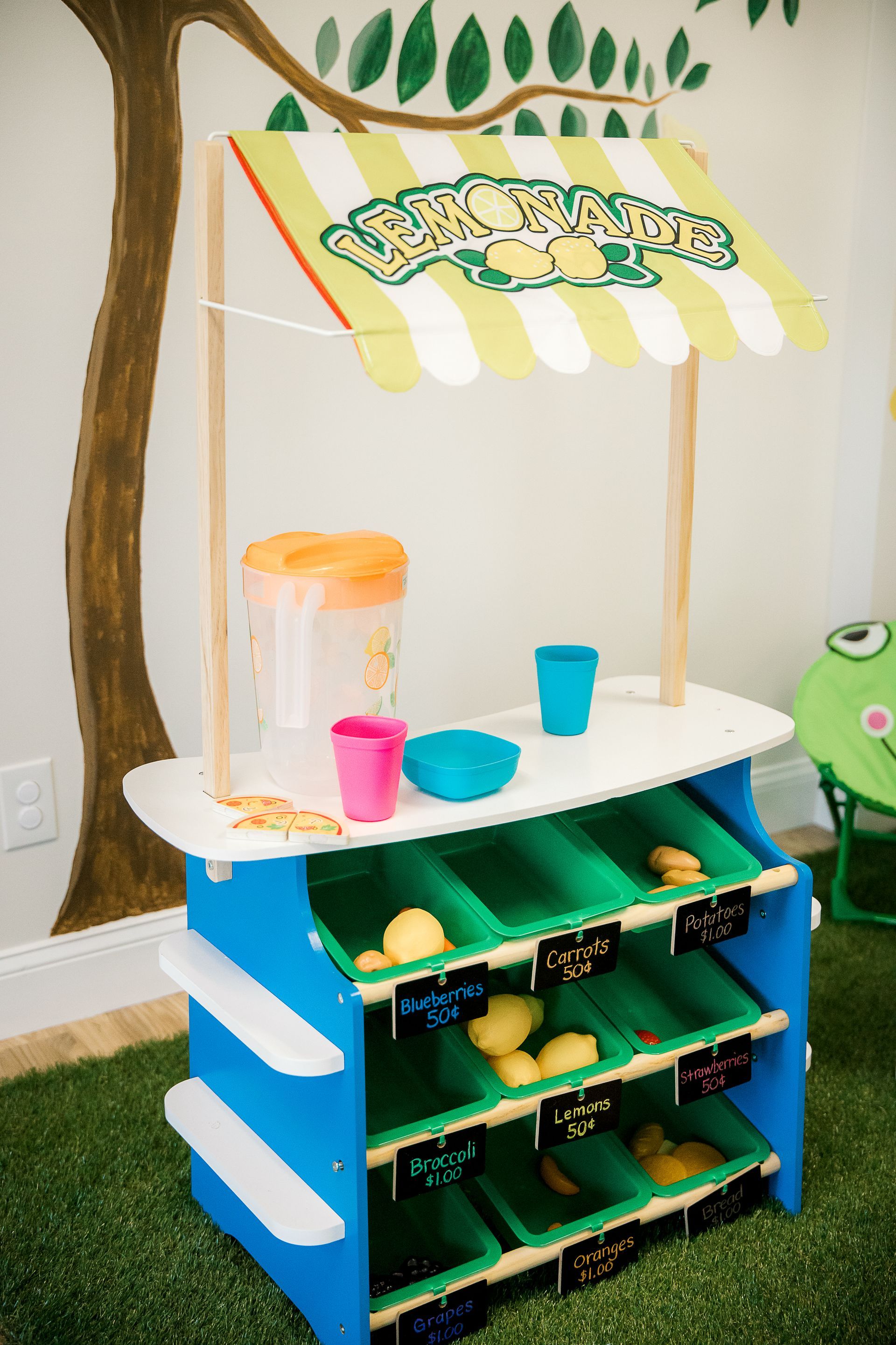 A toy lemonade stand at the indoor playground.