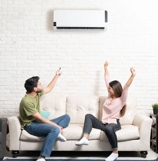 A man and a woman are enjoying a new mini split ac unit in Auburn Al