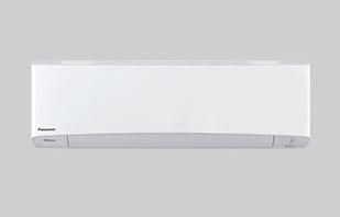 A white air conditioner is hanging on a wall.