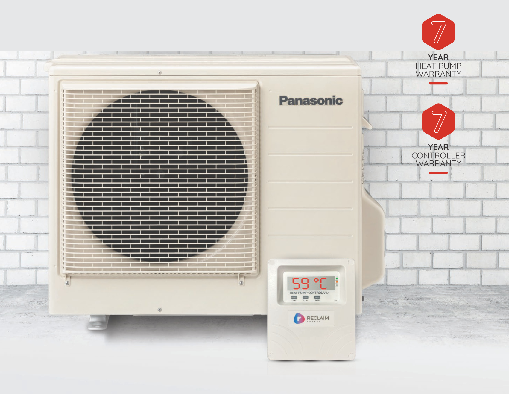 A panasonic air conditioner is sitting in front of a white brick wall.