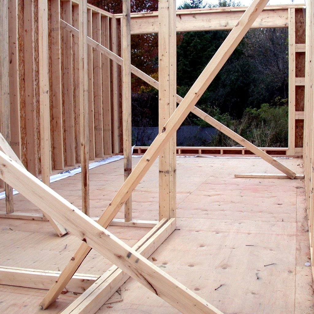 A wooden structure is being built with a wooden floor