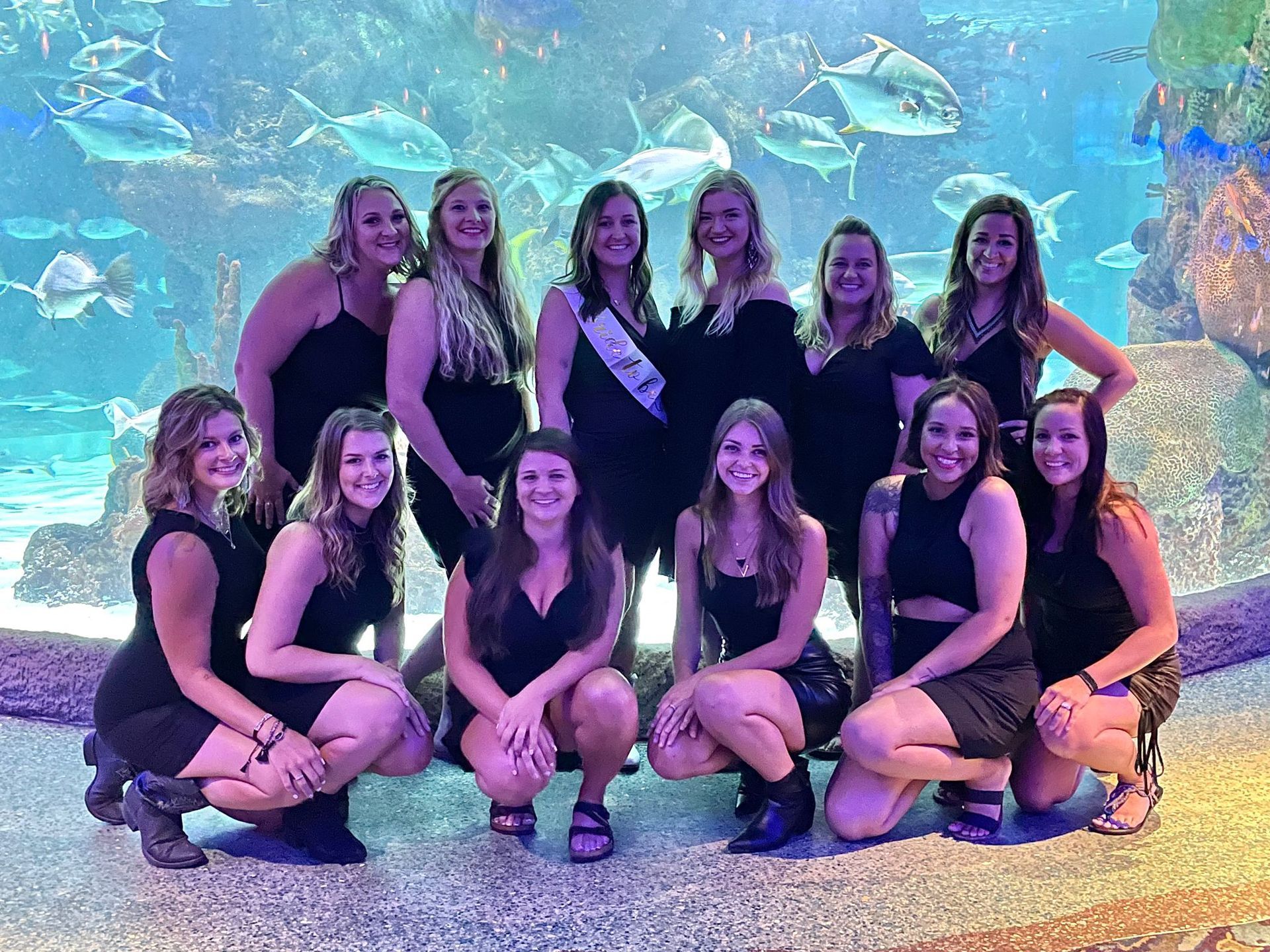 A table with a vase of white flowers on it