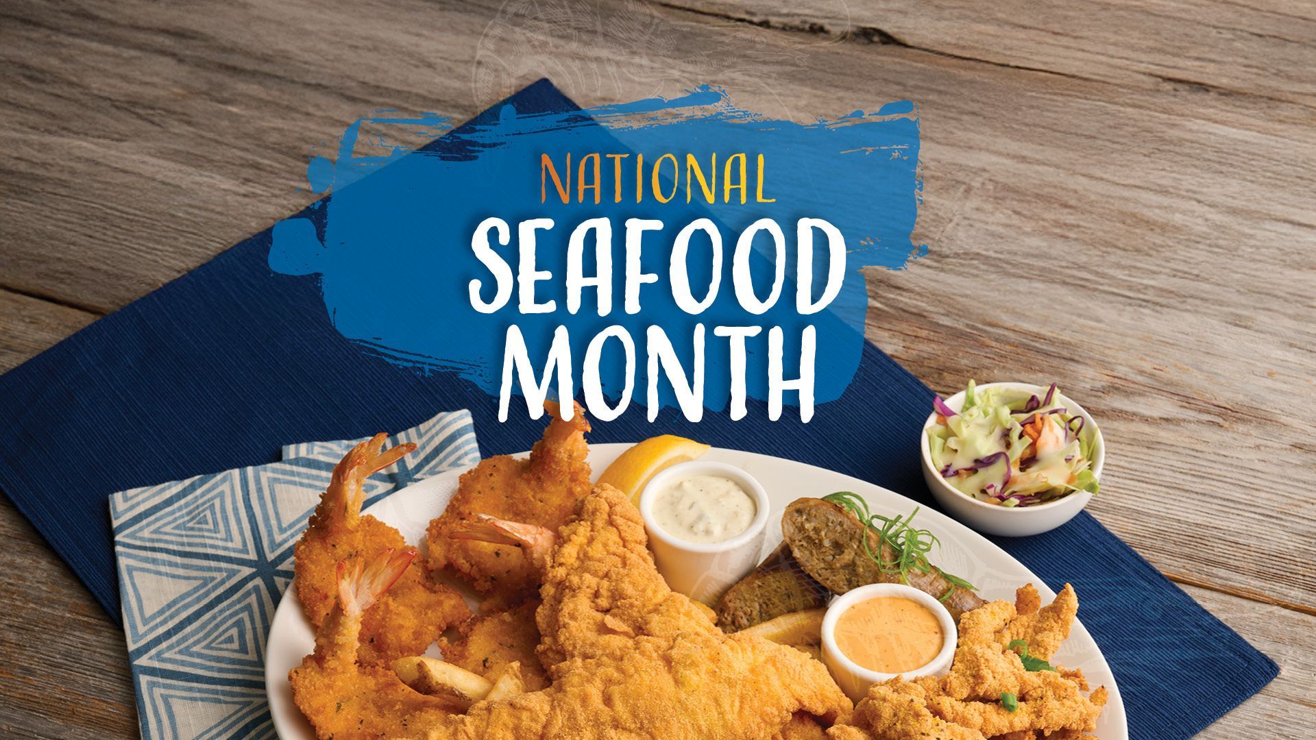 National Seafood Month plate with fried fish, sides, and text.