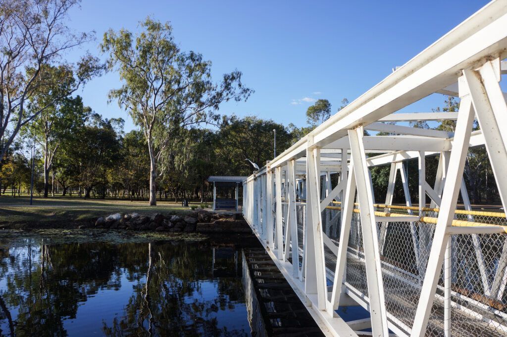 a white metal bridge over water — Crokers Fuel & Oils Pty Ltd in Clermont, QLD