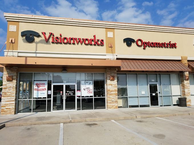 A brick building with the word visionworks on it in conroe