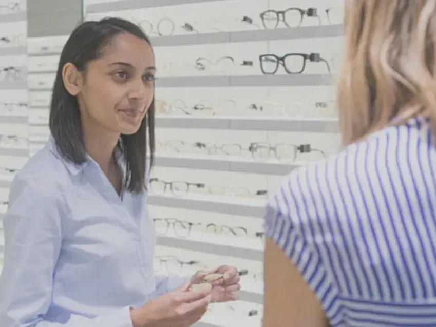 Optician Smiling at Her Client