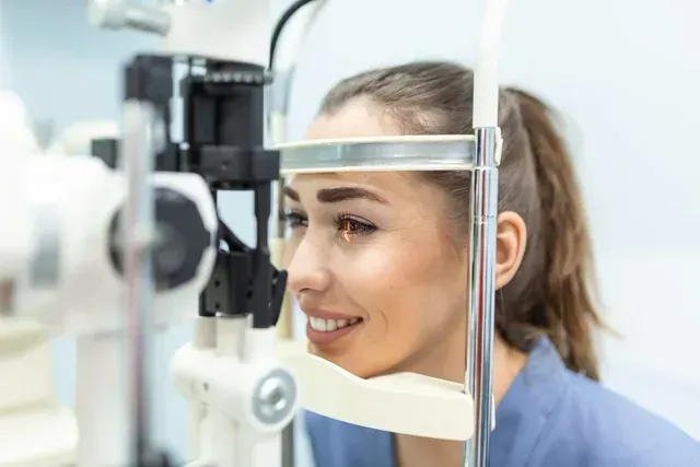 A woman is getting her eyes examined by an ophthalmologist.
