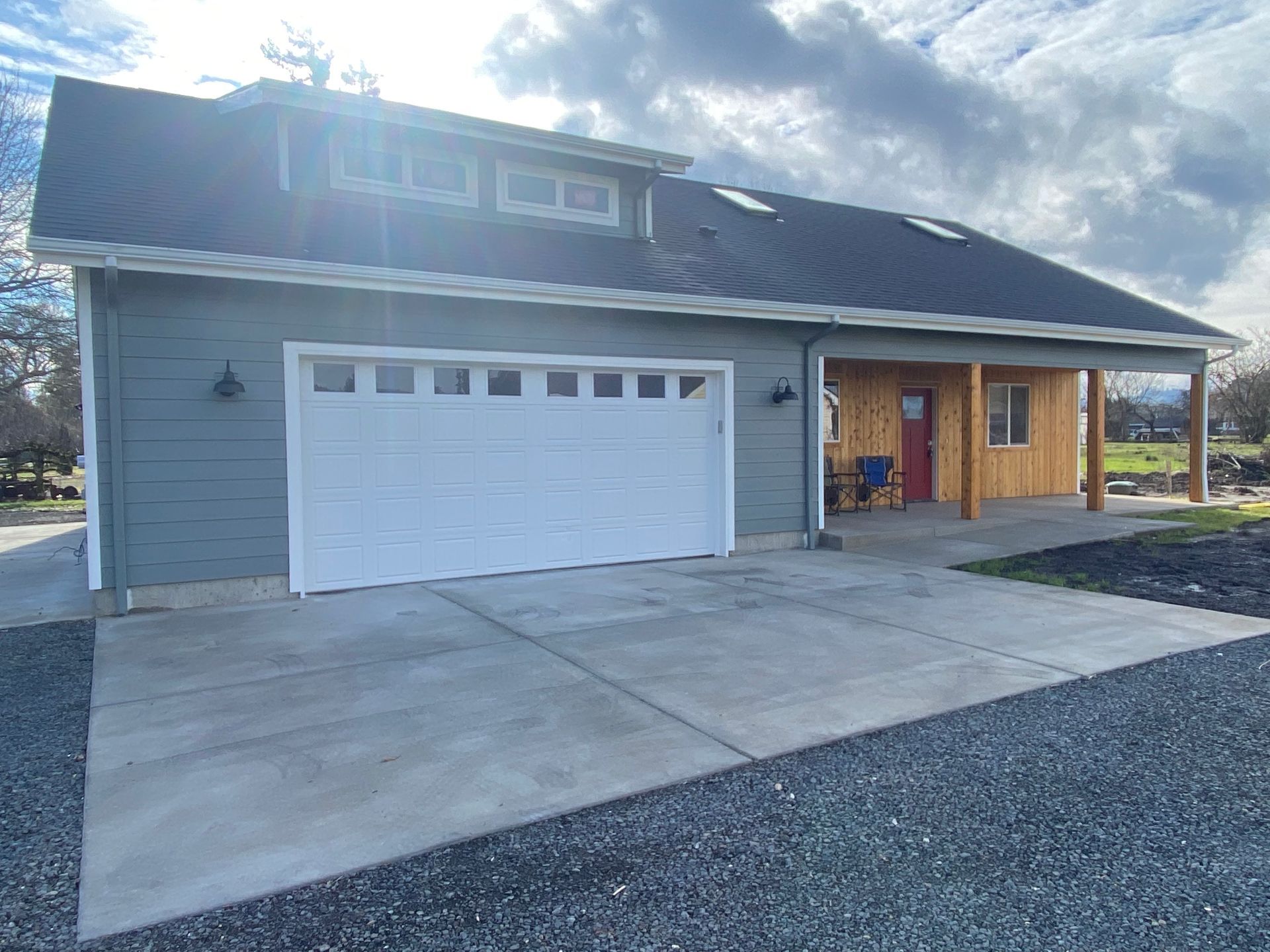 A house with a garage door and a porch.