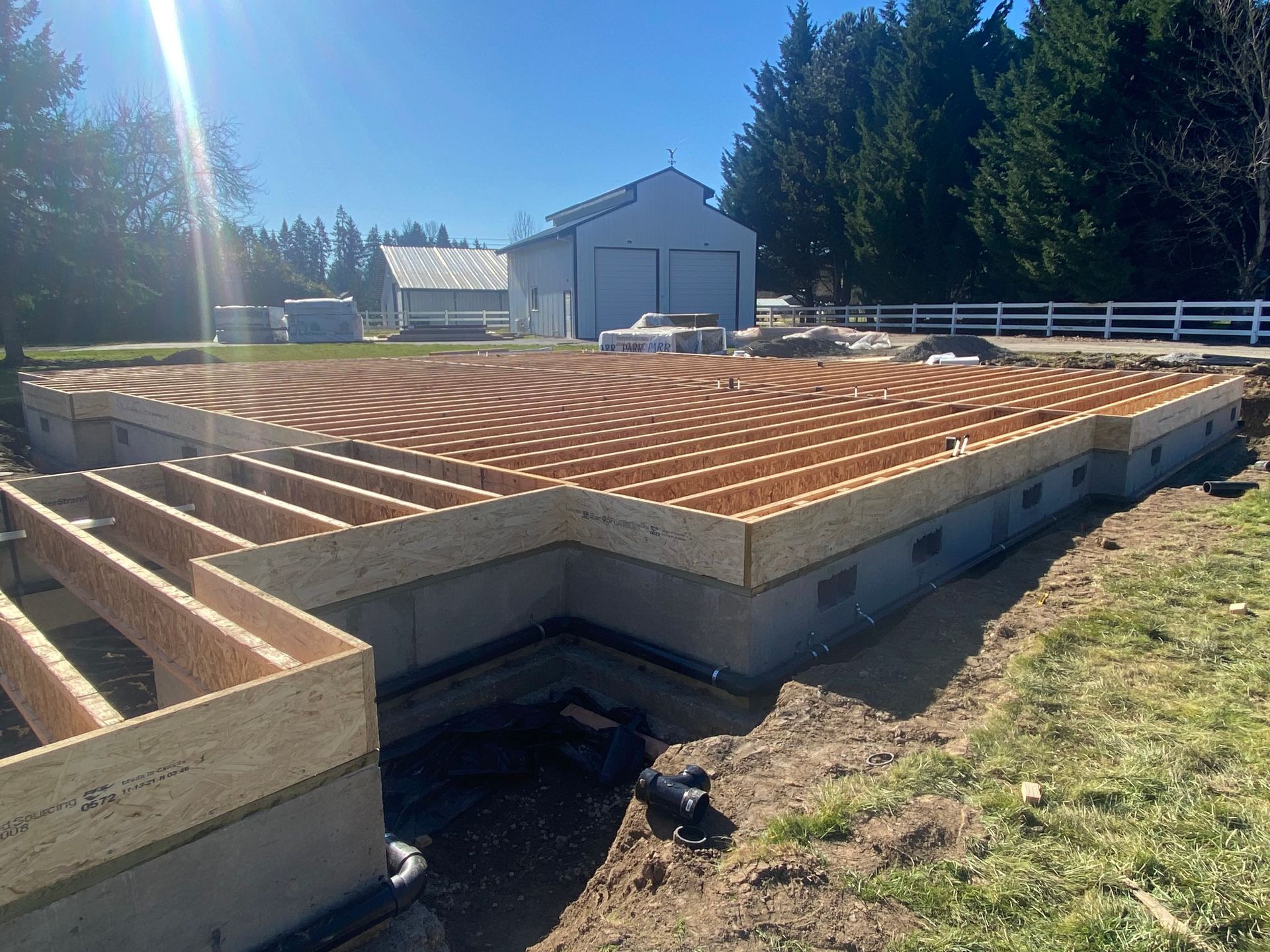 A foundation for a house is being built on a sunny day