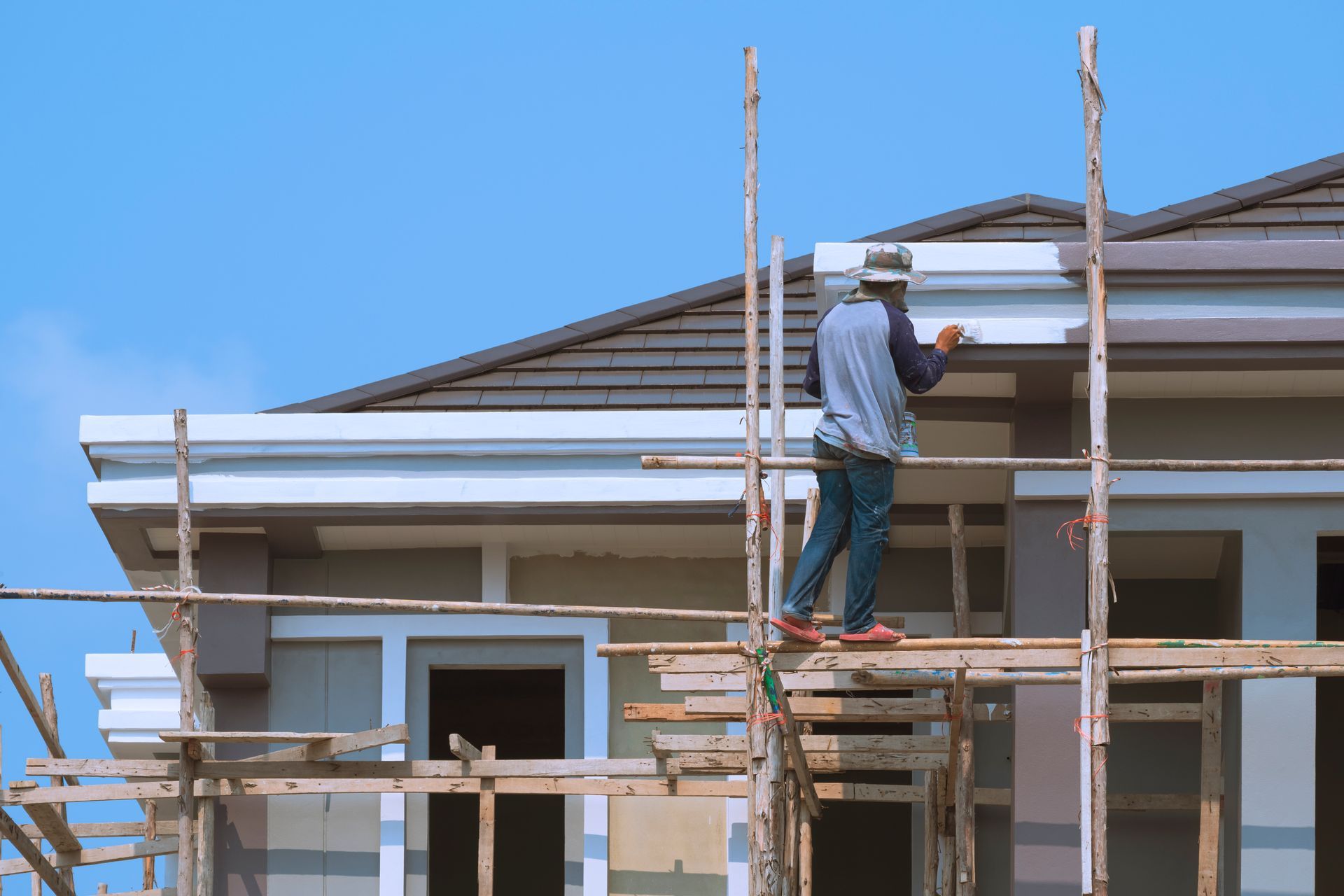 builder worker on wooden-scaffolding