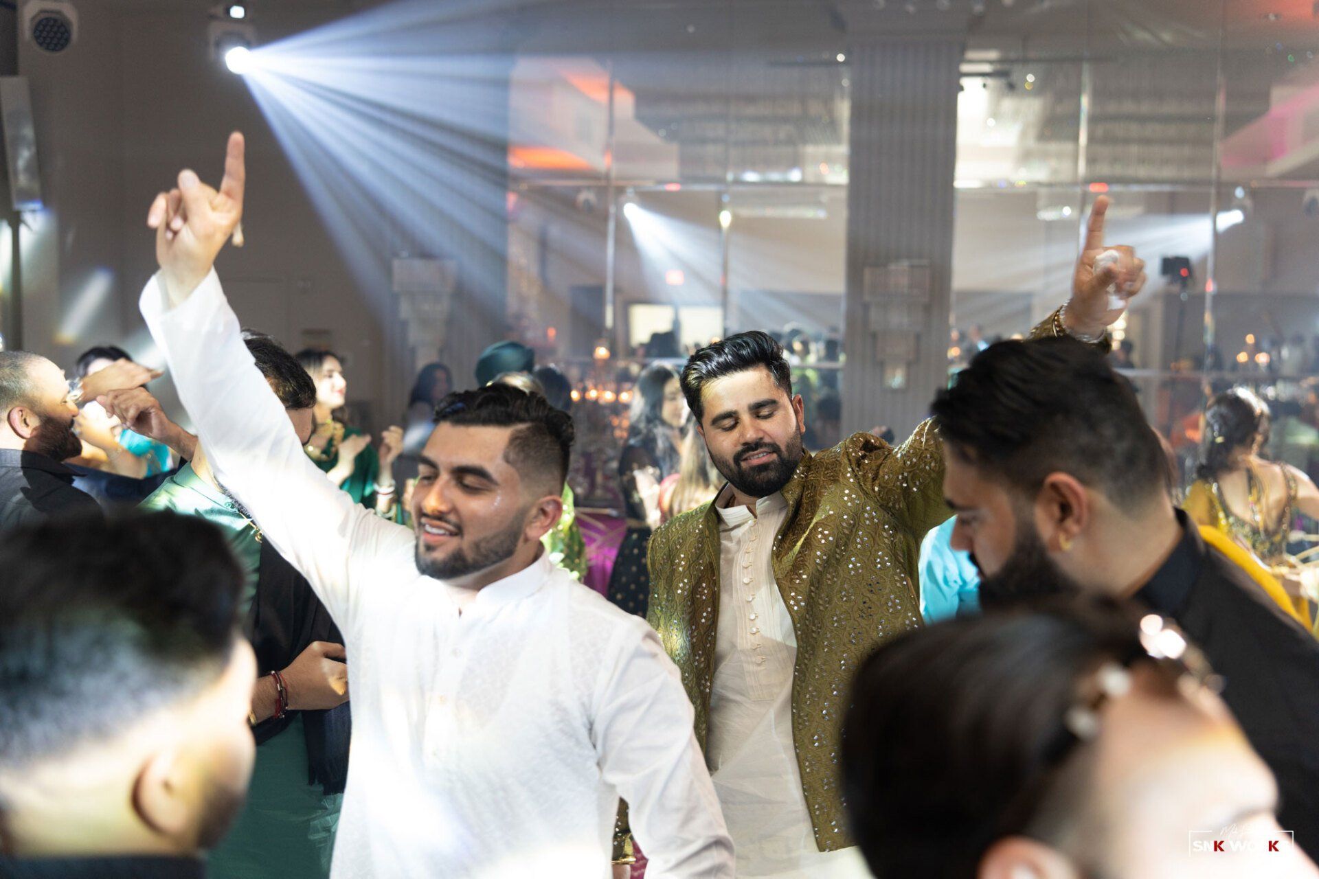 men dancing at an Indian wedding in Fairfax, VA at CrystalView Weddings and Events