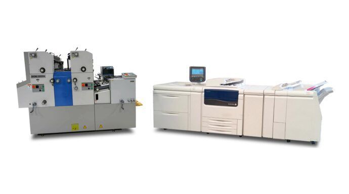 Two printing machines are sitting next to each other on a white background.