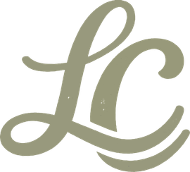 Stylized gold cursive &ldquo;LC&rdquo; monogram on a white background