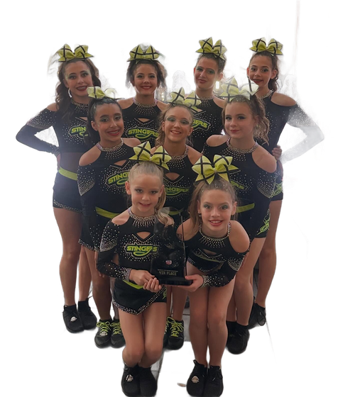 Cheerleading squad in black uniforms with teal accents, posing with rubber ducks.