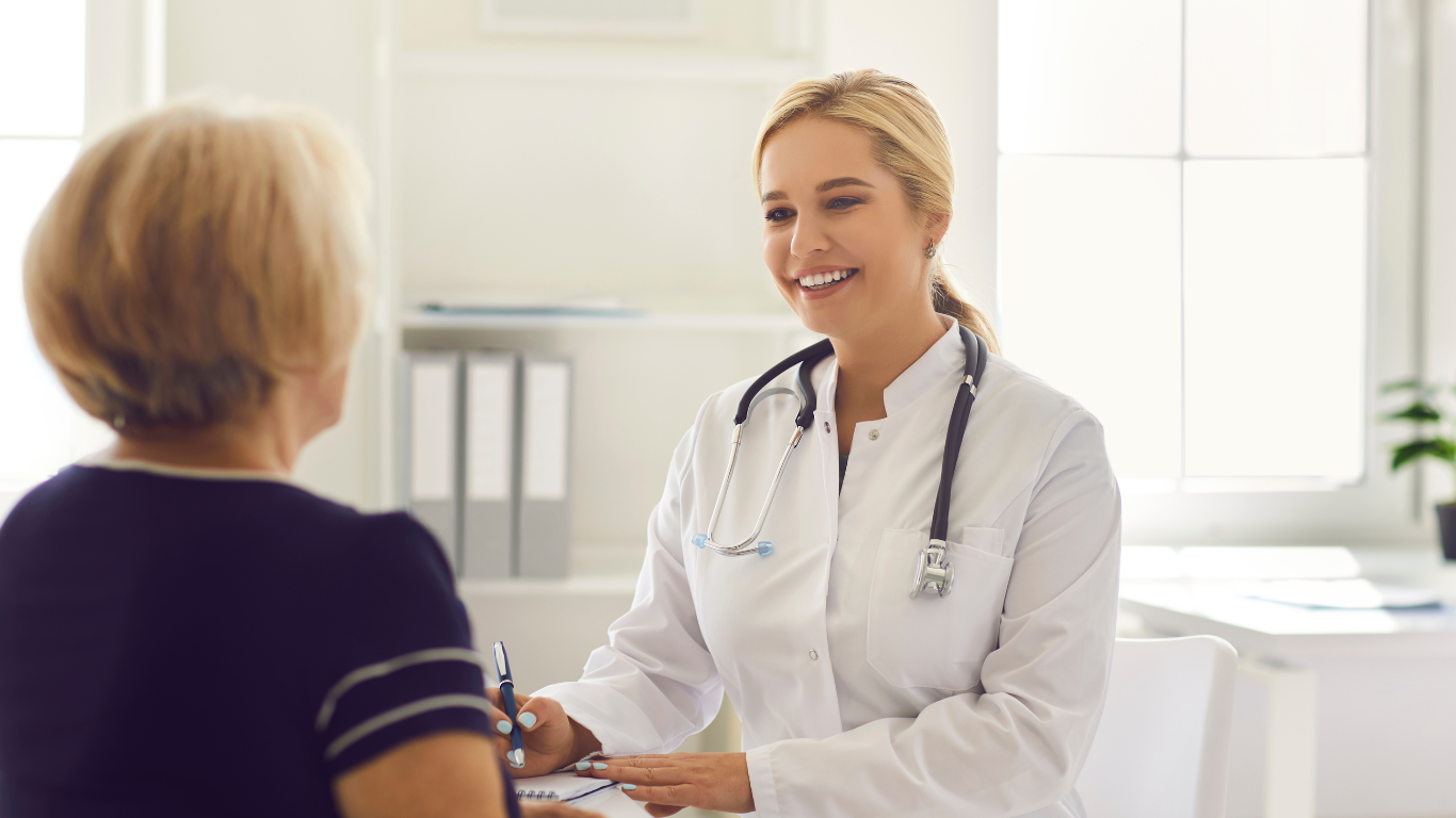 A man wearing a mask is being examined by a doctor.