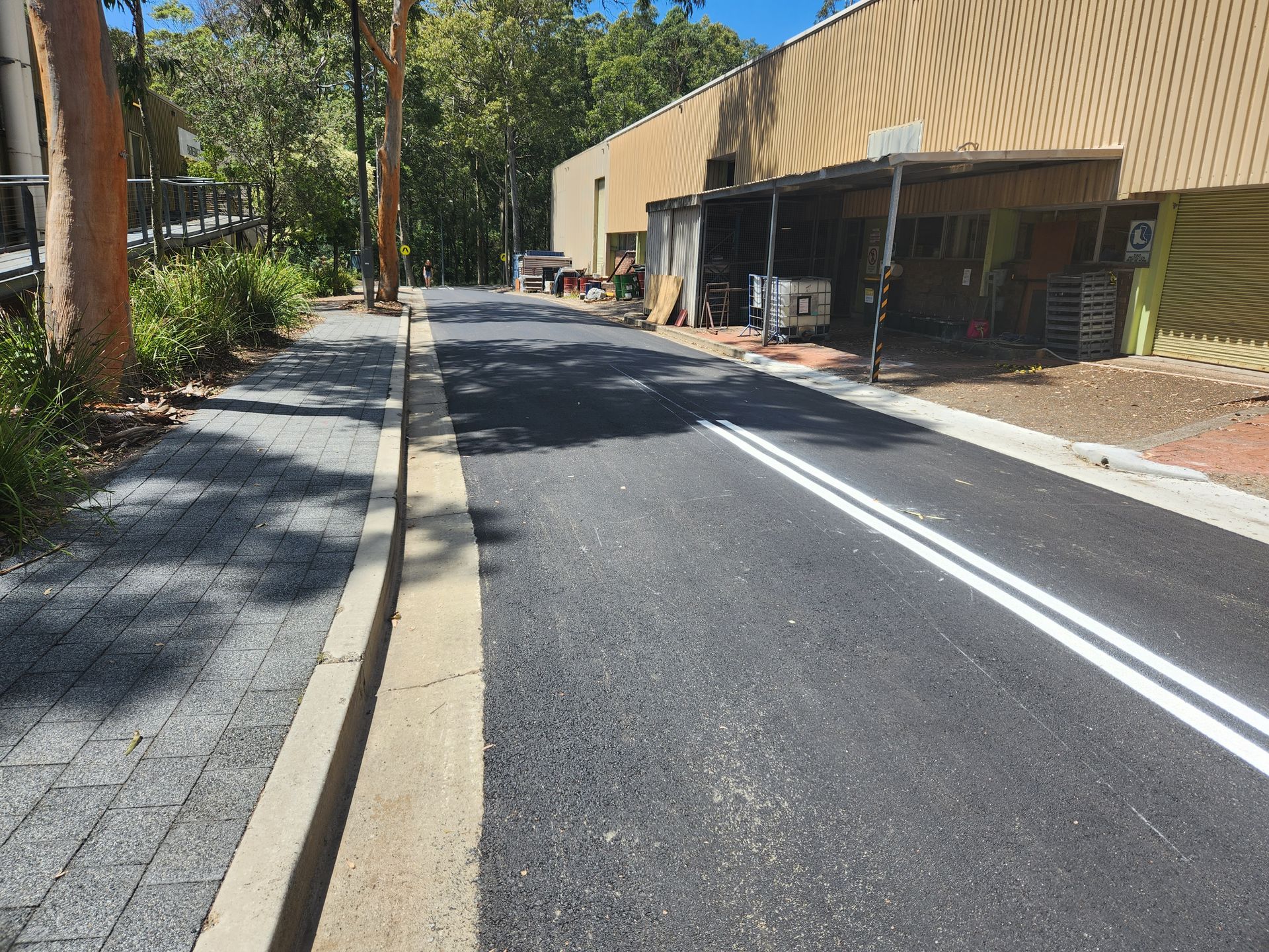 Asphalt Road With White Lines — TAC Asphalt Services in Warners Bay, NSW