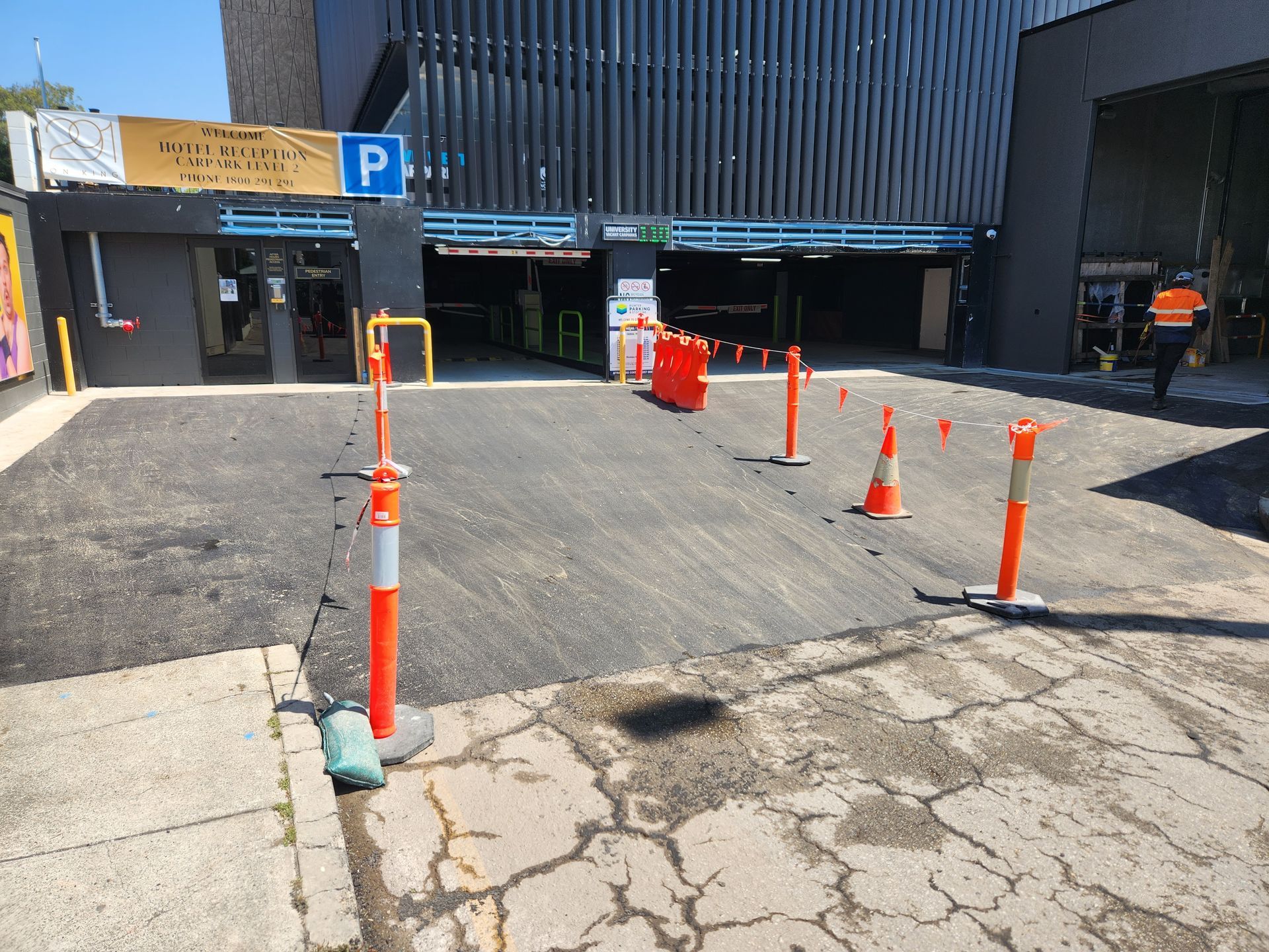 Parking Garage Entrance Ramp With Orange Traffic Cones — TAC Asphalt Services in Warners Bay, NSW