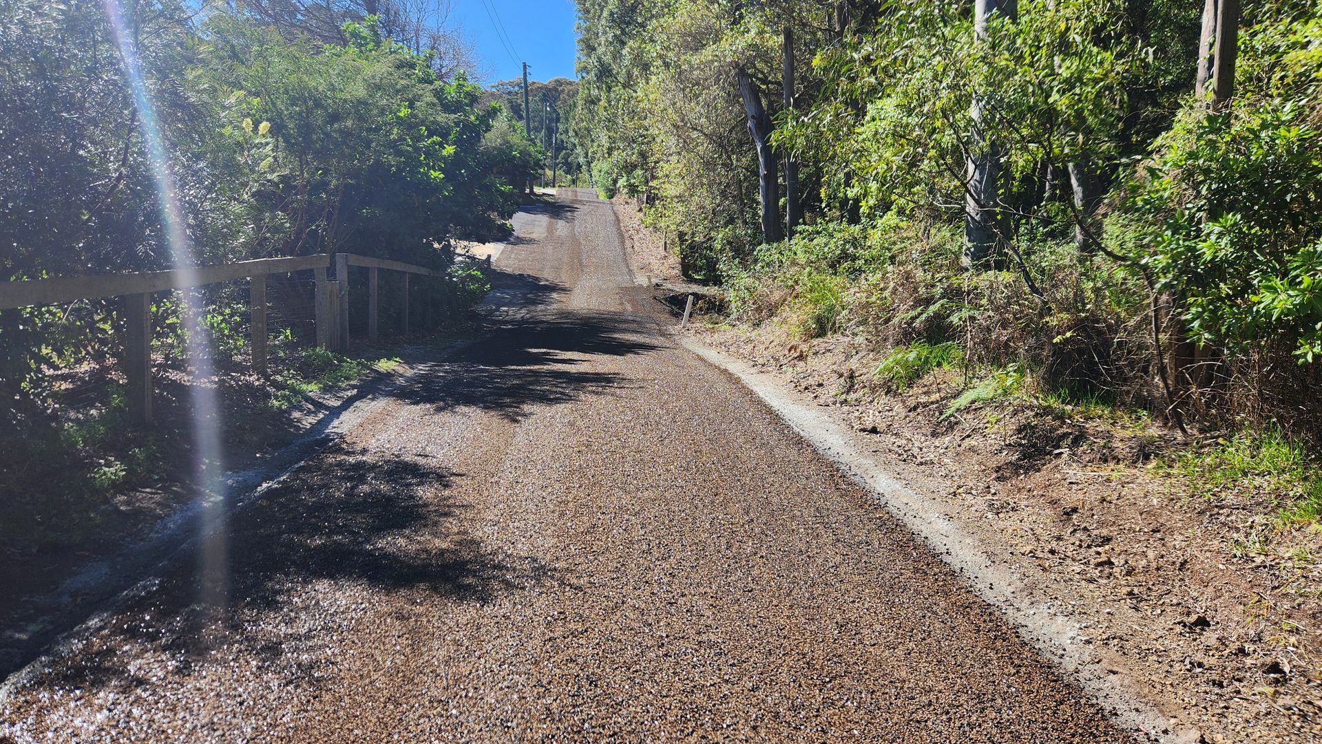 Gravel Path Winding Uphill Through A Forest — TAC Asphalt Services in Warners Bay, NSW