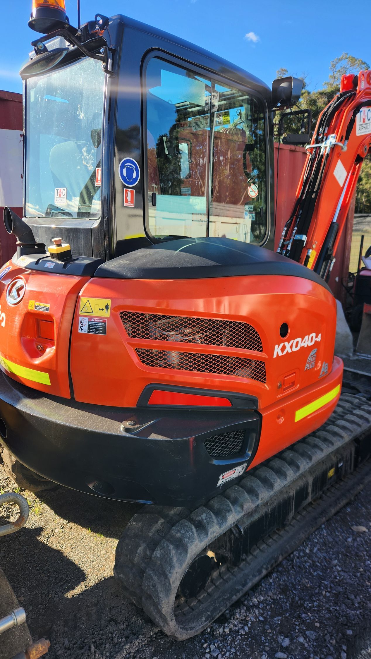 Orange And Black Kubota— TAC Asphalt Services in Warners Bay, NSW