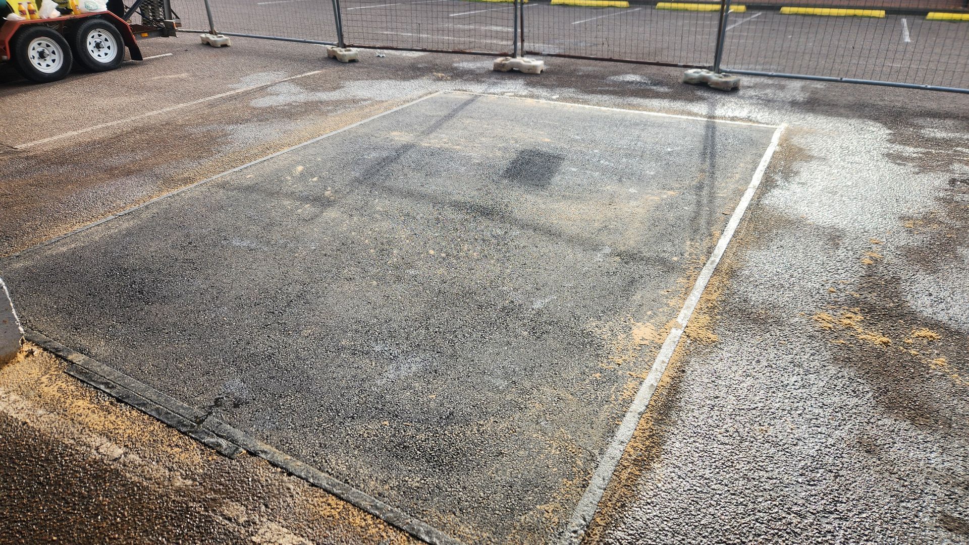 A Gravel-covered Parking Space, Outlined With White Lines — TAC Asphalt Services in Warners Bay, NSW