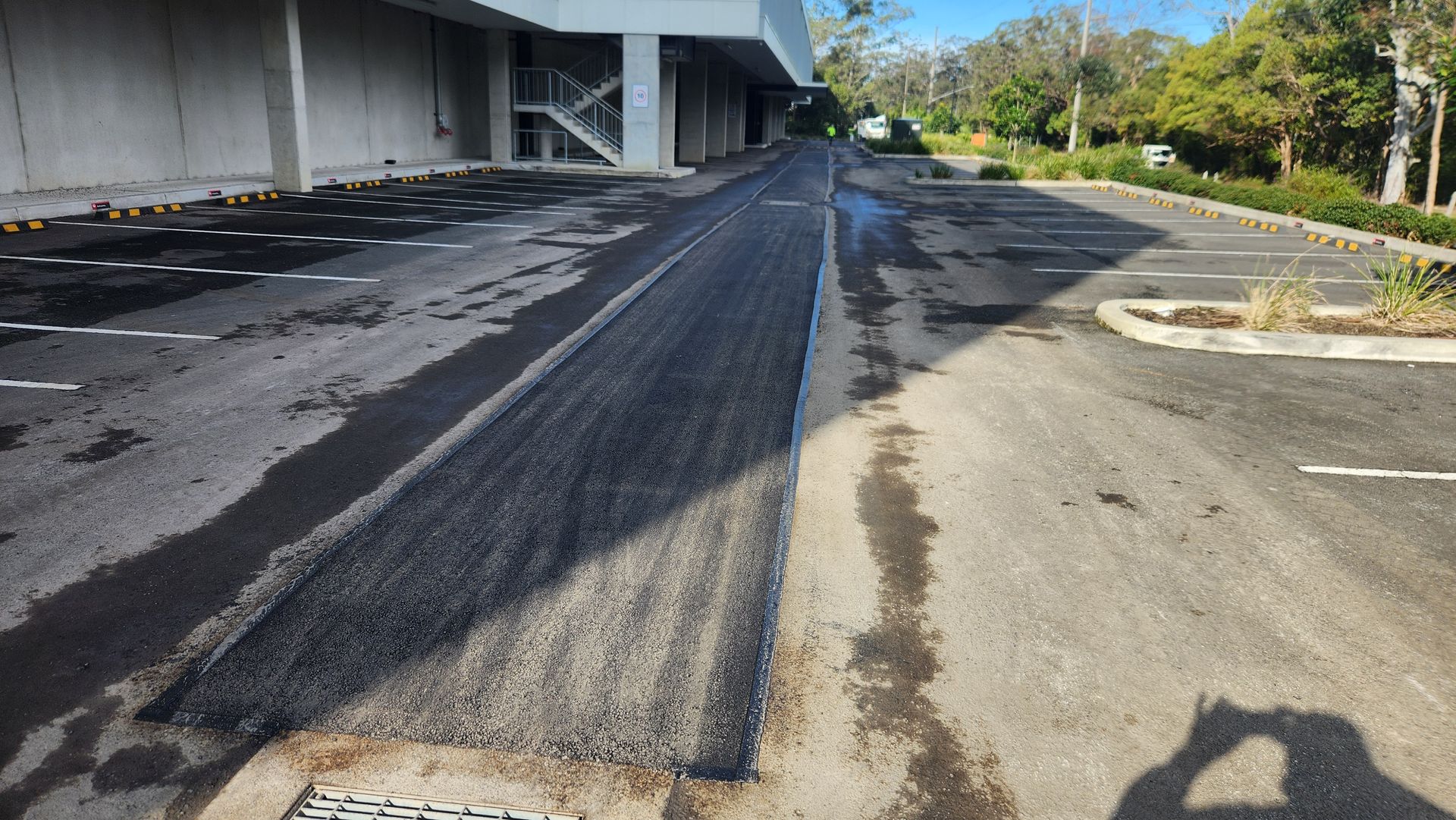 Asphalt Road With Recent Patching — TAC Asphalt Services in Warners Bay, NSW