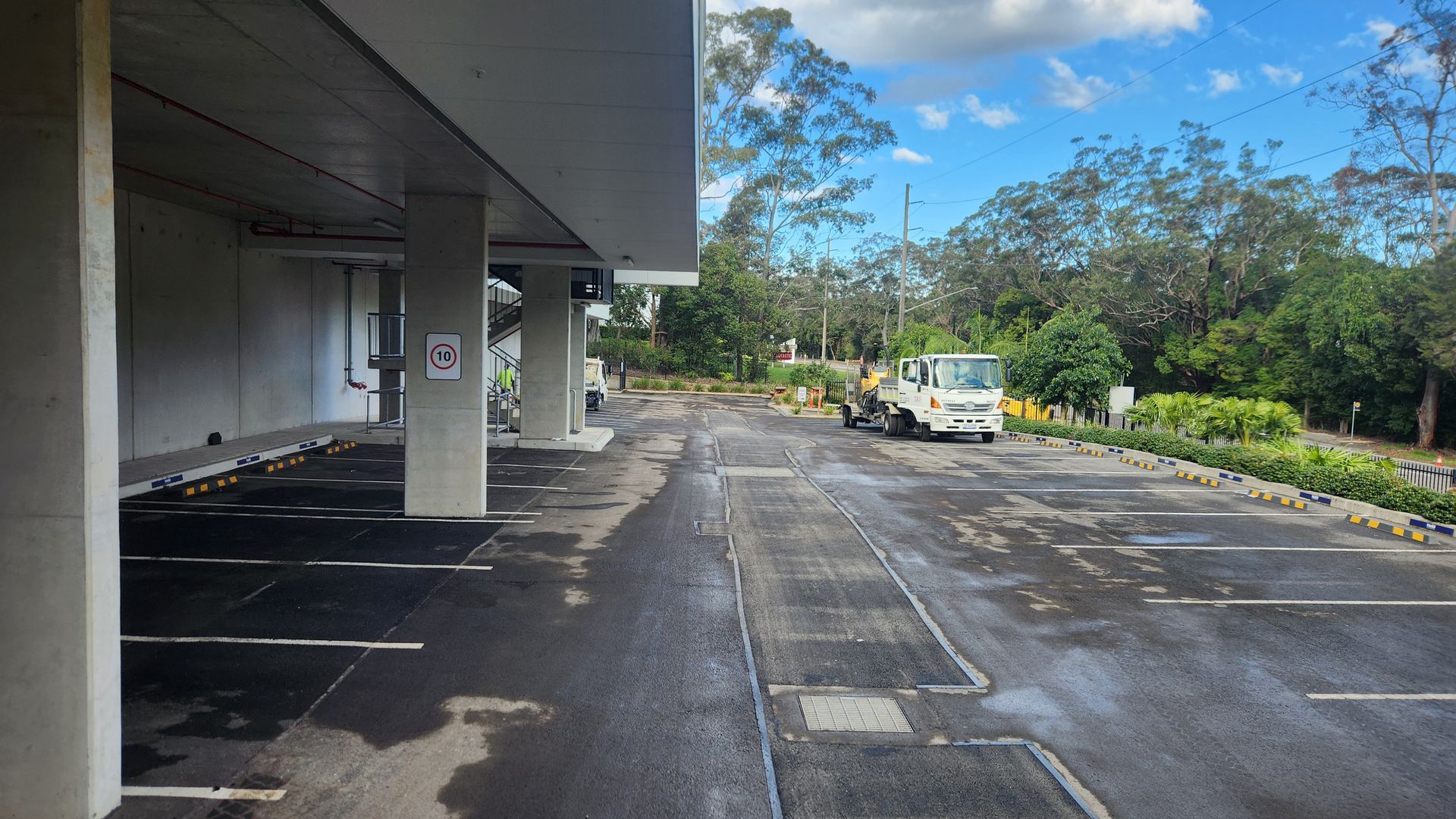 Parking Area With A White Vehicle — TAC Asphalt Services in Warners Bay, NSW