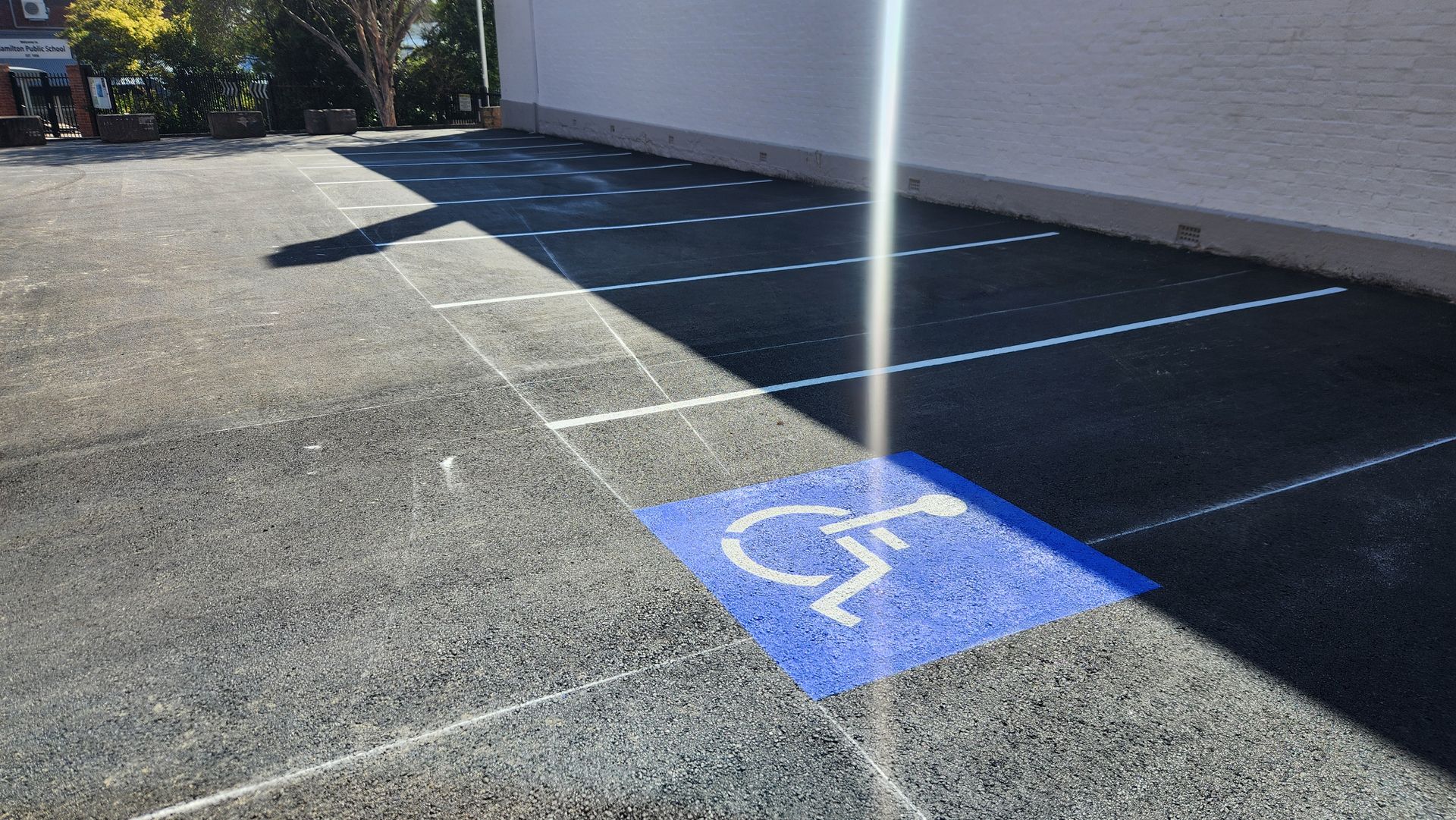 Handicap Parking Space With Blue Symbol On Asphalt — TAC Asphalt Services in Warners Bay, NSW