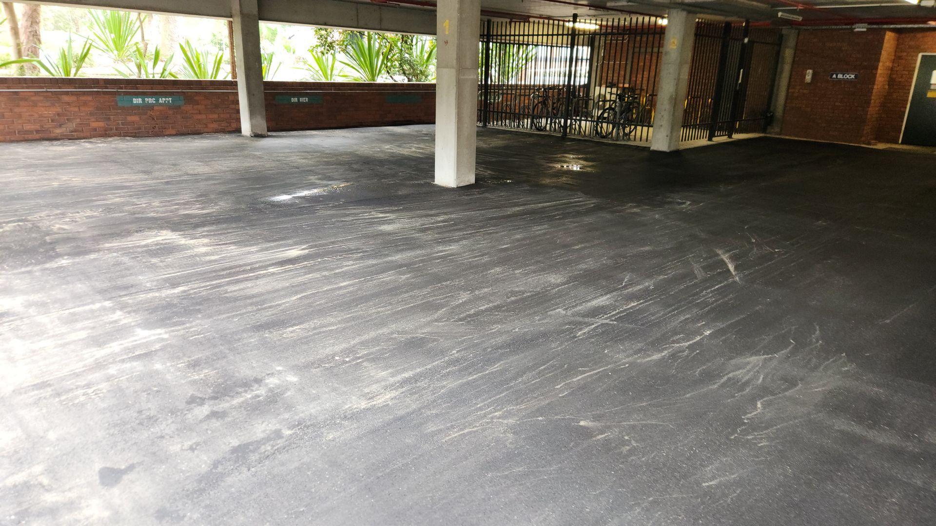 Concrete Parking Area Under a Building, With Multiple Support Columns — TAC Asphalt Services in Warners Bay, NSW