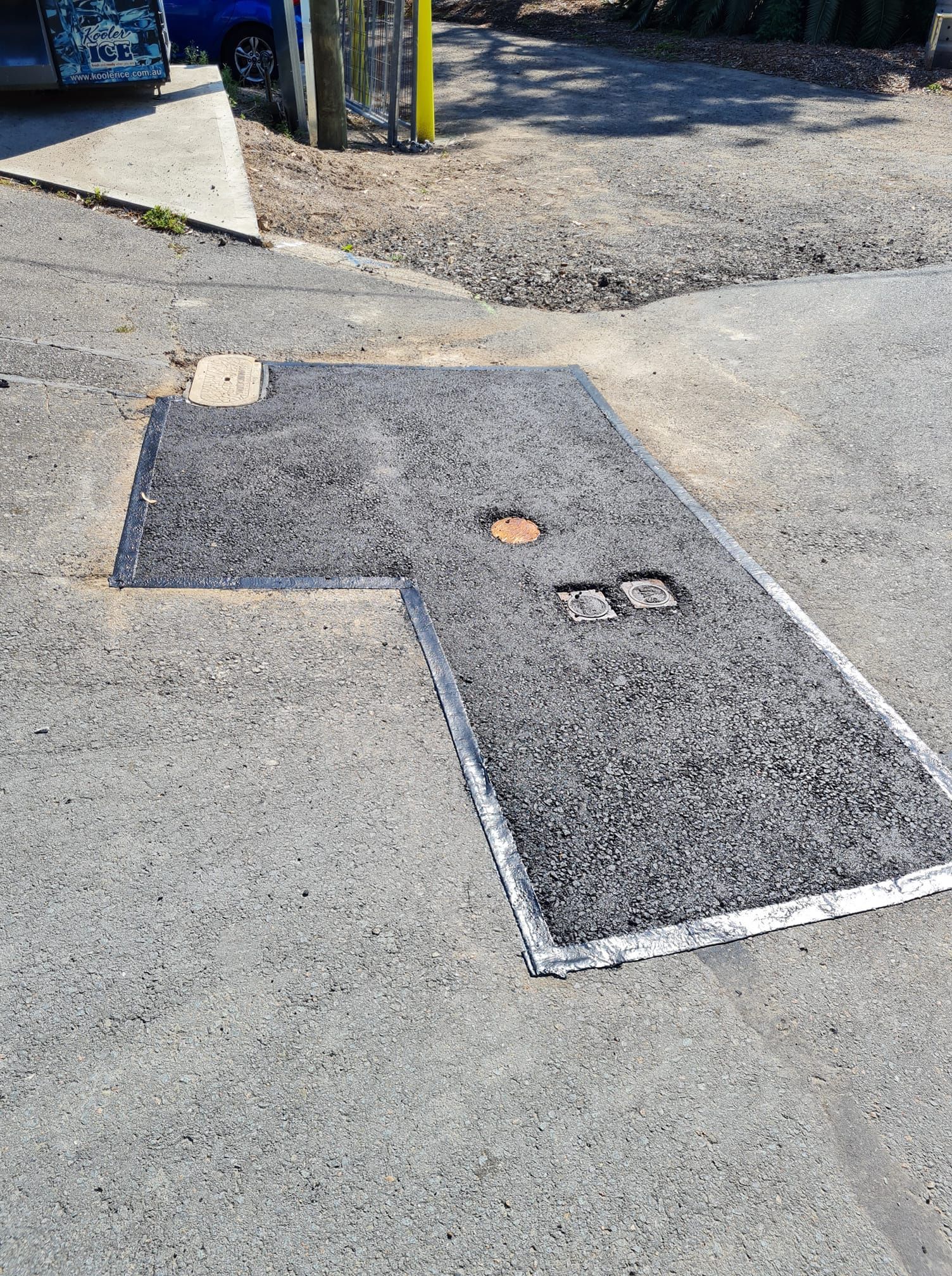 Asphalt Patch With Metal Edge, Angled L-shape in a Paved Area — TAC Asphalt Services in Warners Bay, NSW