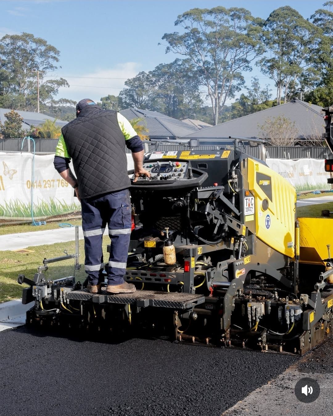 Worker Operating Asphalt Paving Machine on a Street — TAC Asphalt Services in Warners Bay, NSW