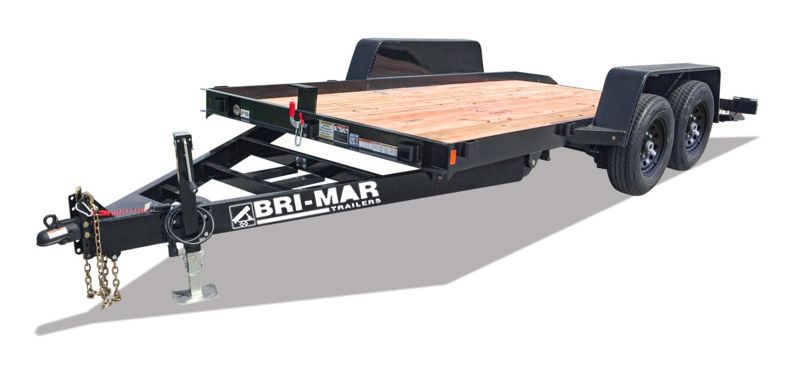 A flatbed trailer with a wooden deck on a white background.