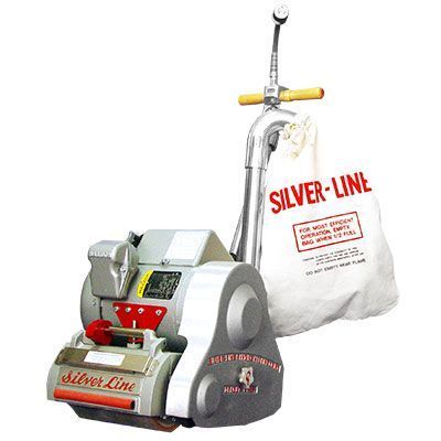 A silver line floor sander with a bag attached to it