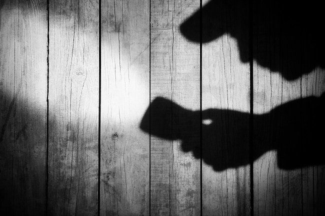 shadow of an investigator in action