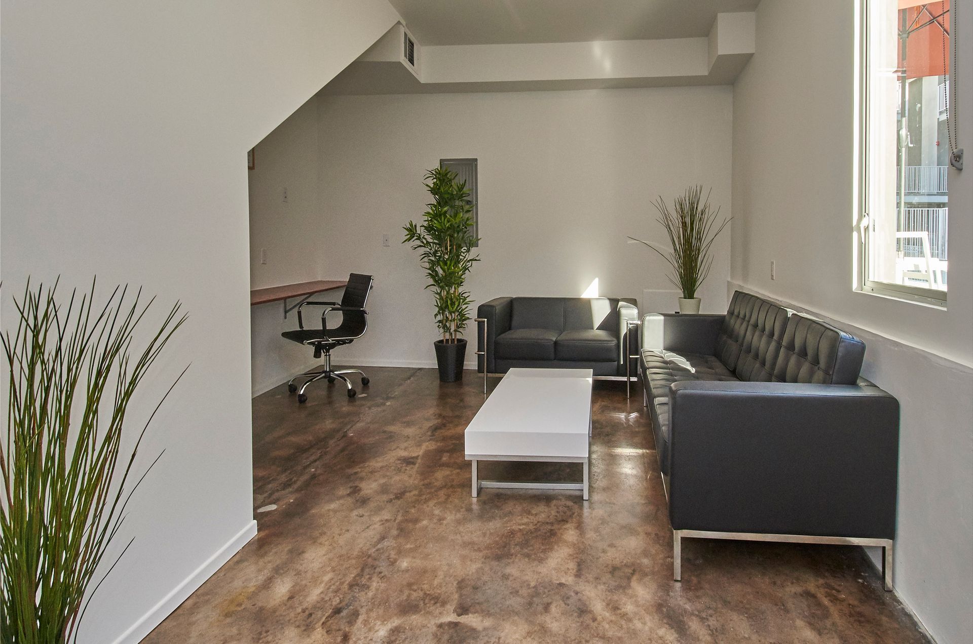 A living room with a couch and a table