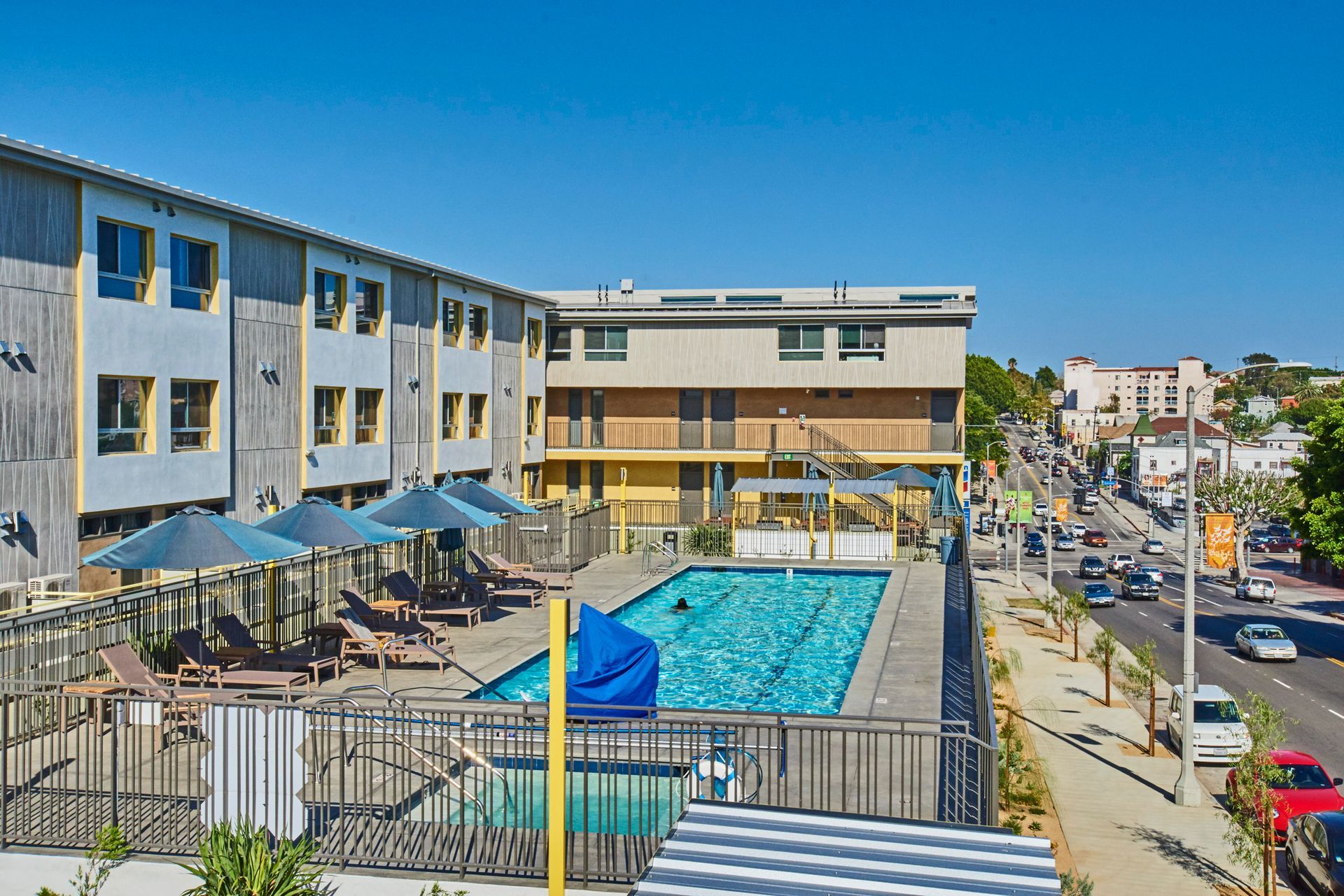 A large building with a swimming pool in front of it
