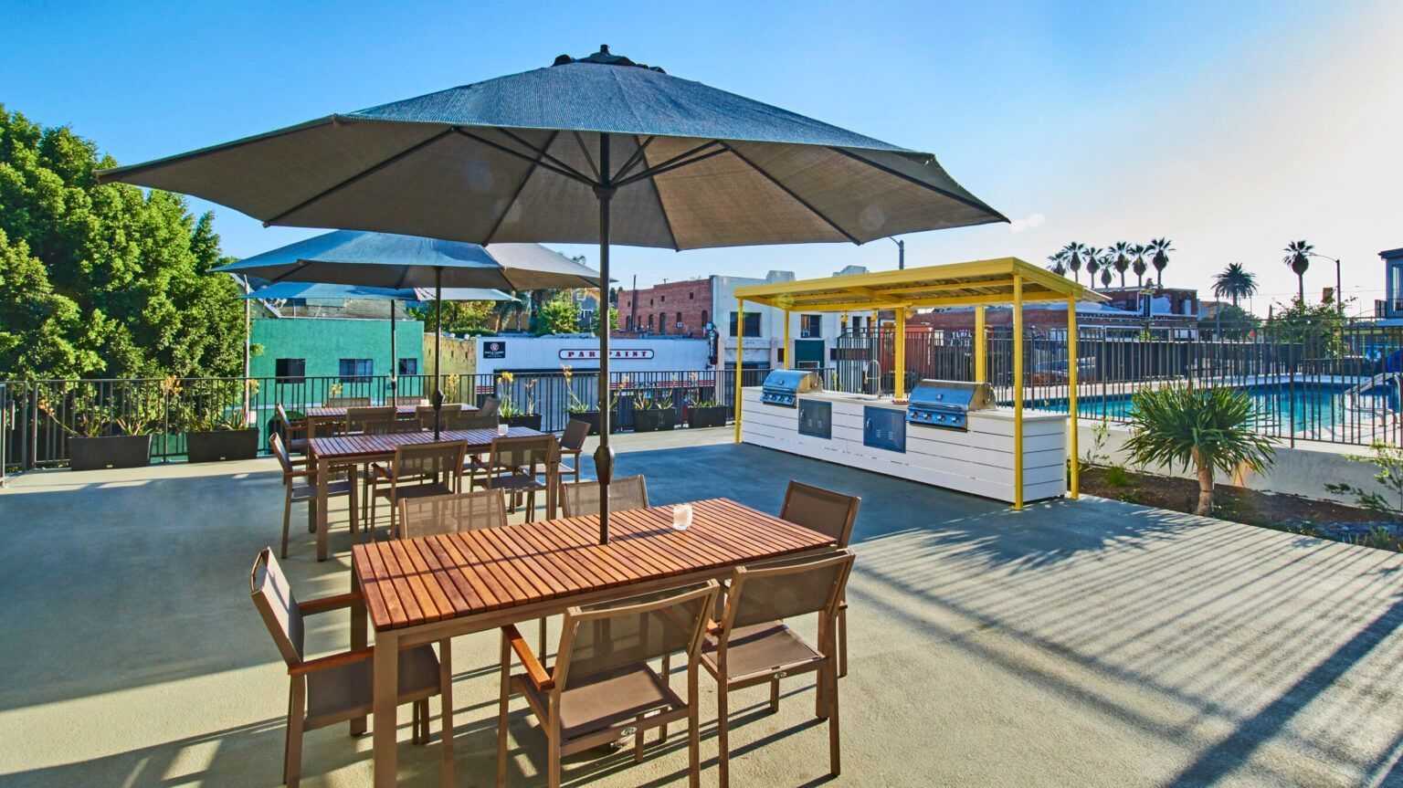  Outside Area, Echo, 1647 Temple Street -A patio with tables and chairs under an umbrella.