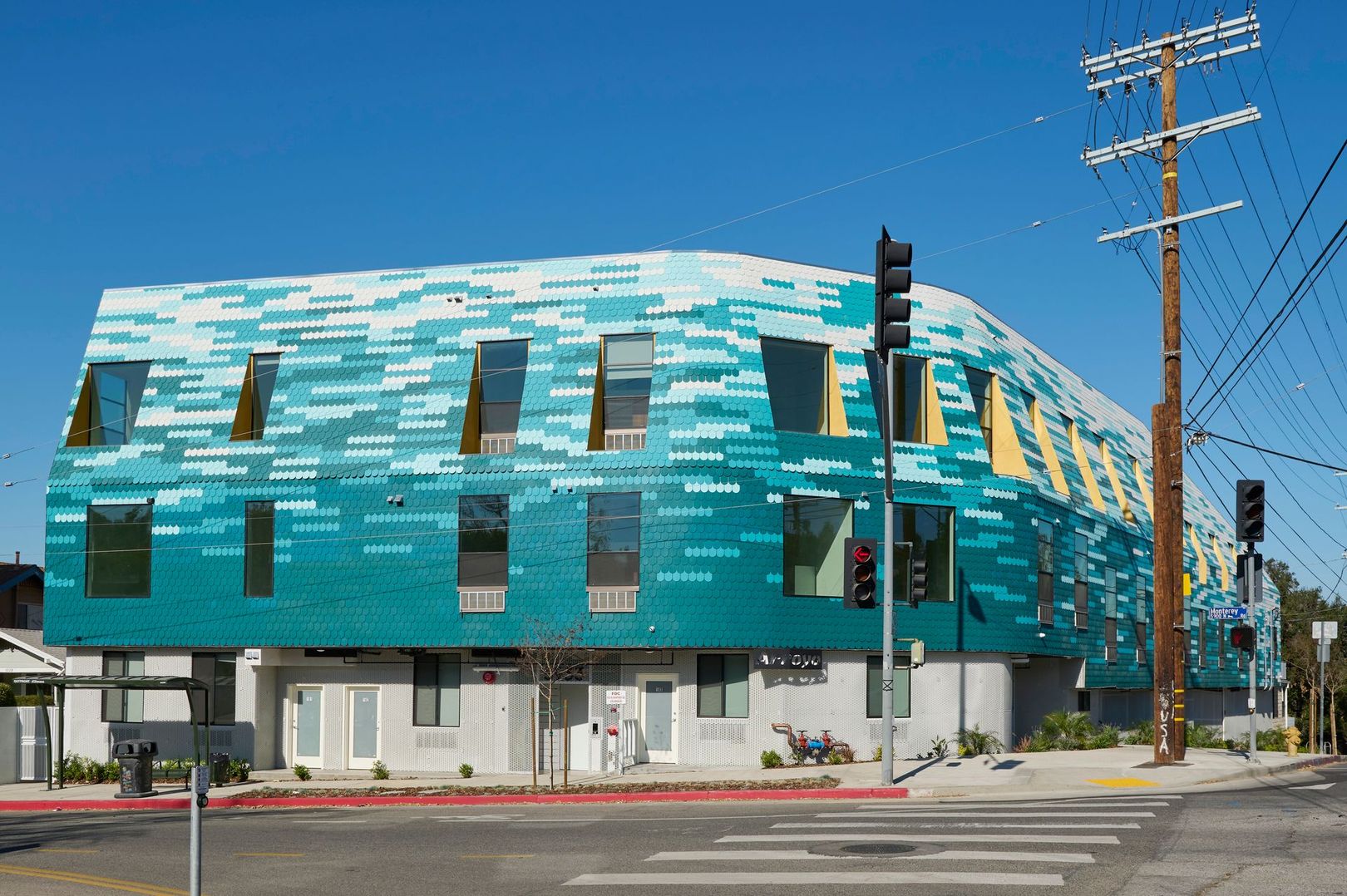 Arroyo, 5933 Monterey Road building with a blue and white facade is on the corner of a street.