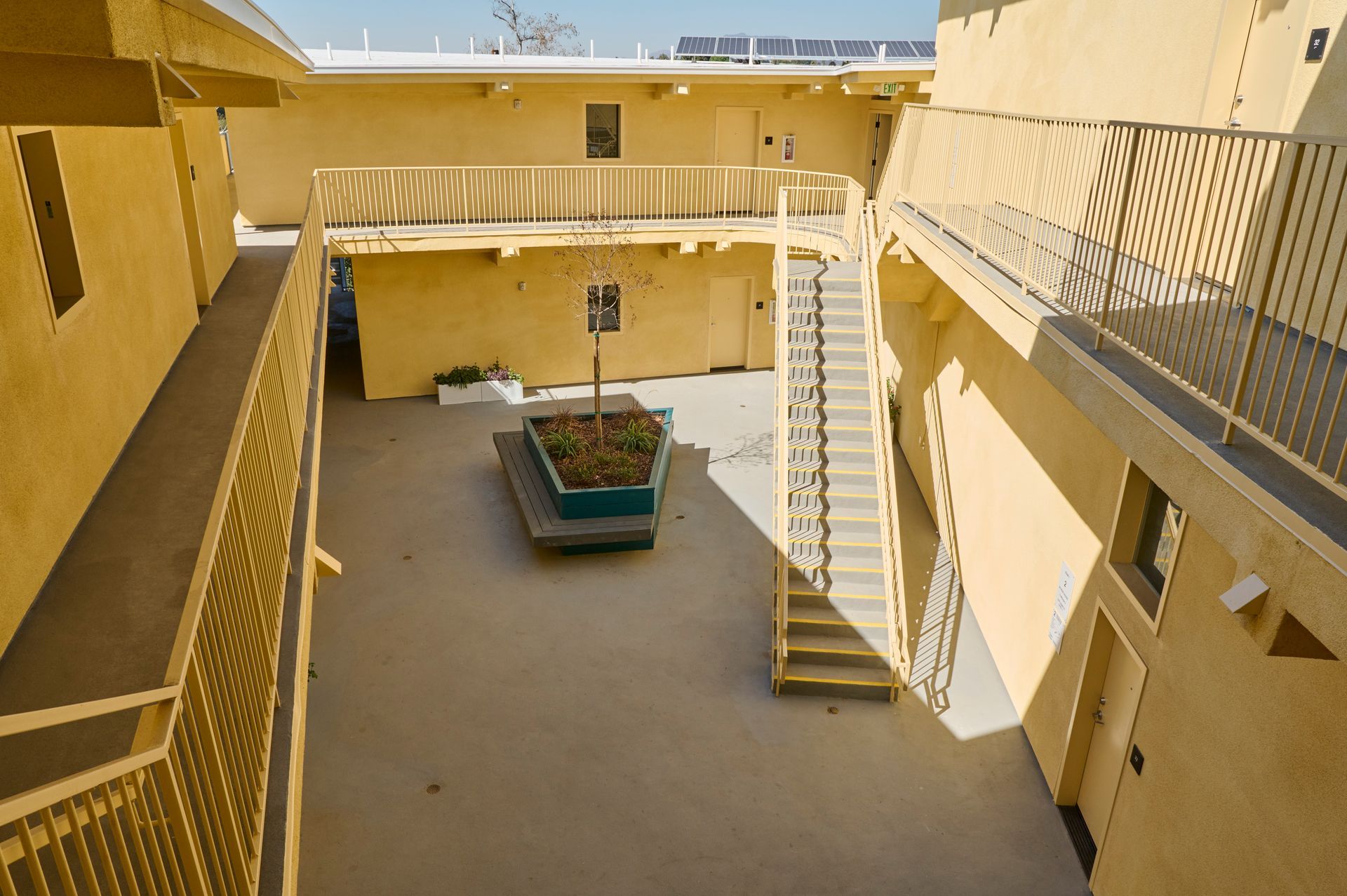 A building with stairs leading up to the second floor