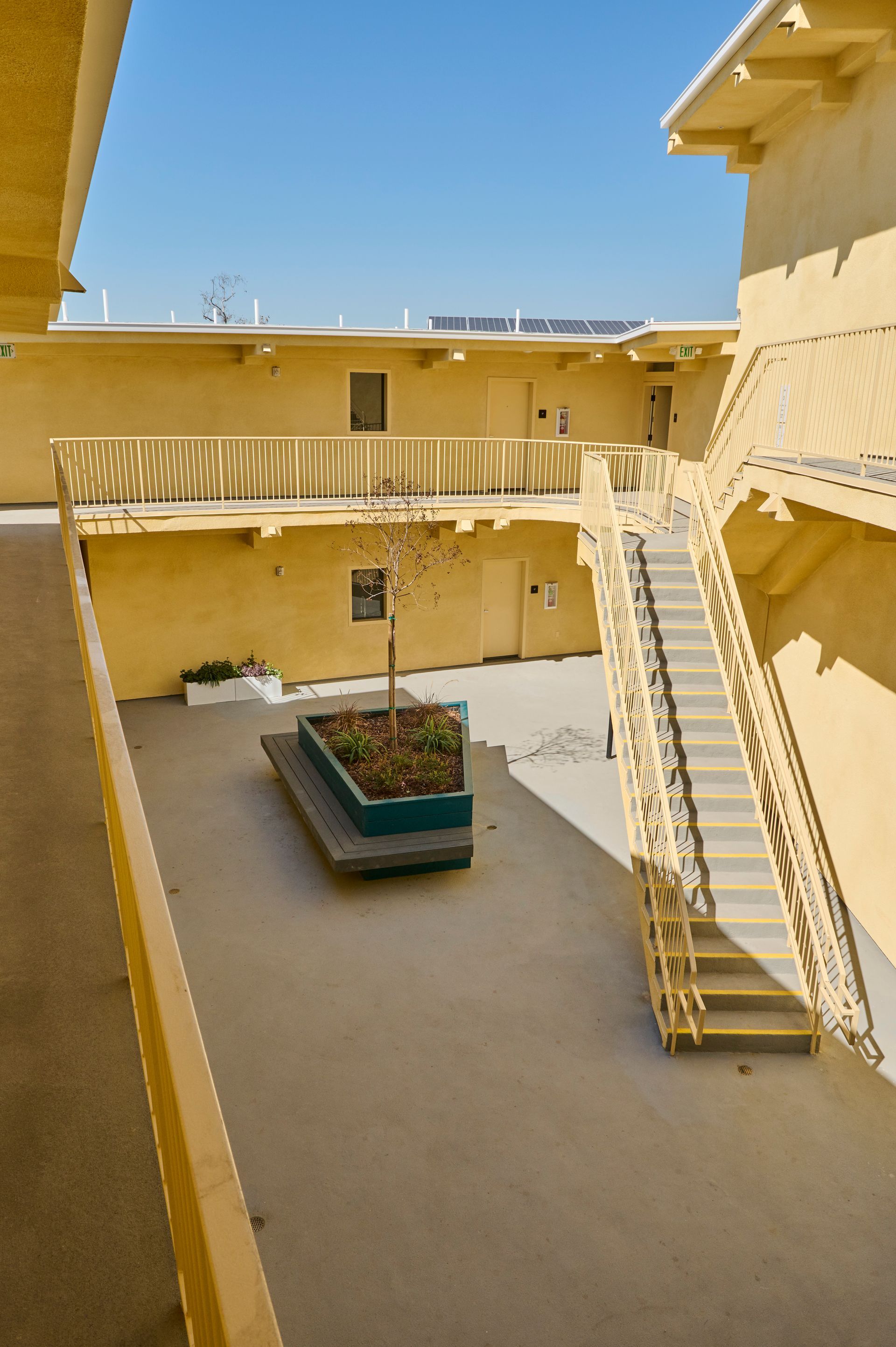 A building with stairs leading up to the second floor
