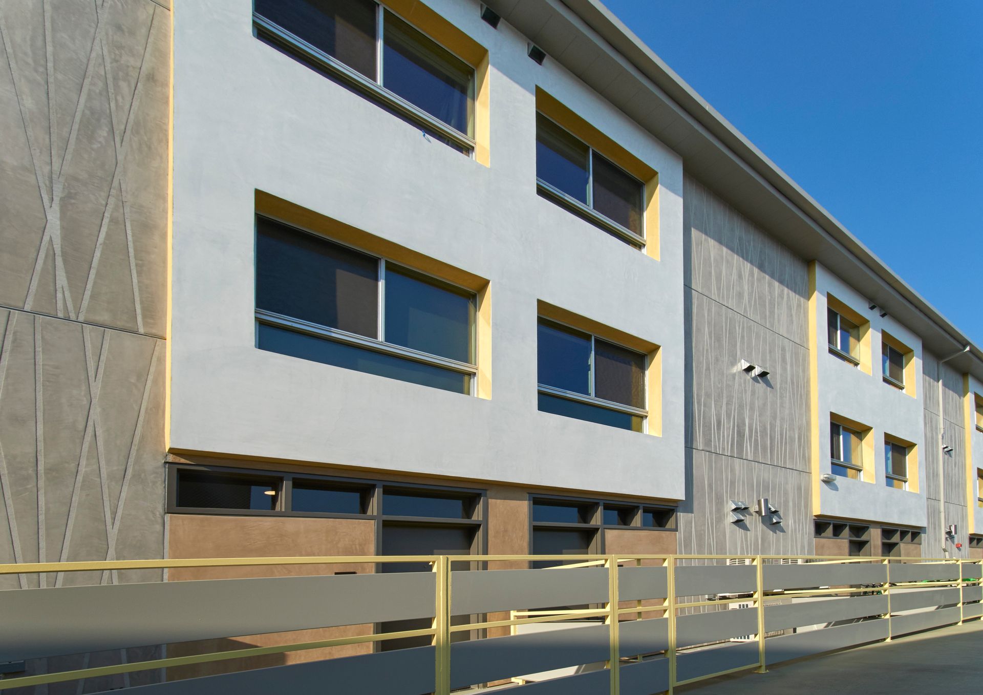 A large building with a fence in front of it