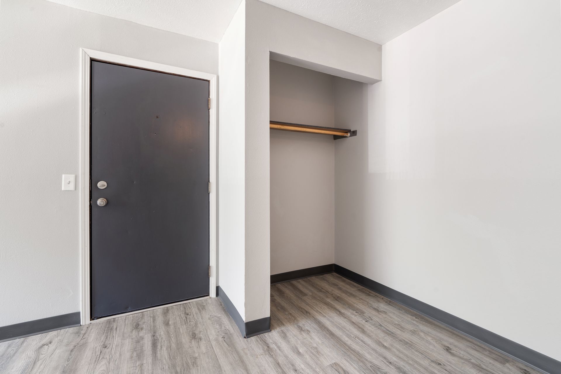 There is a closet in the corner of the room.