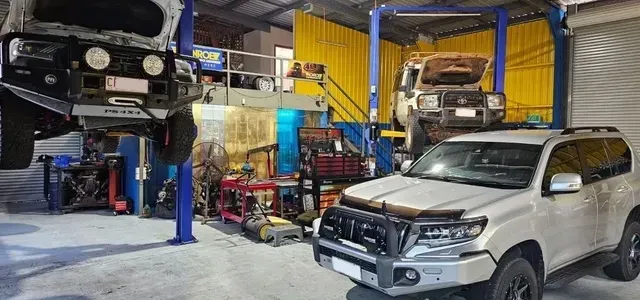 Three Cars In A Mechanic Garage — NT Auto Repairs in Winnellie, NT