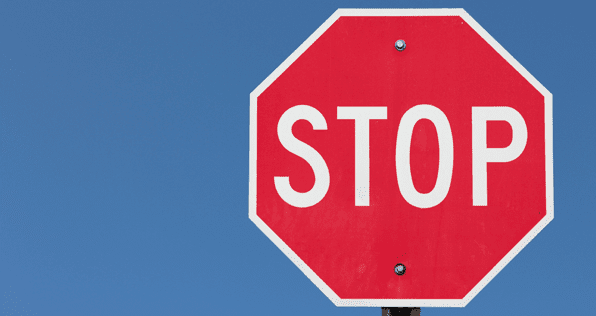 A Red Stop Sign Against A Blue Sky — PTS Traffic Management in Smithfield, QLD