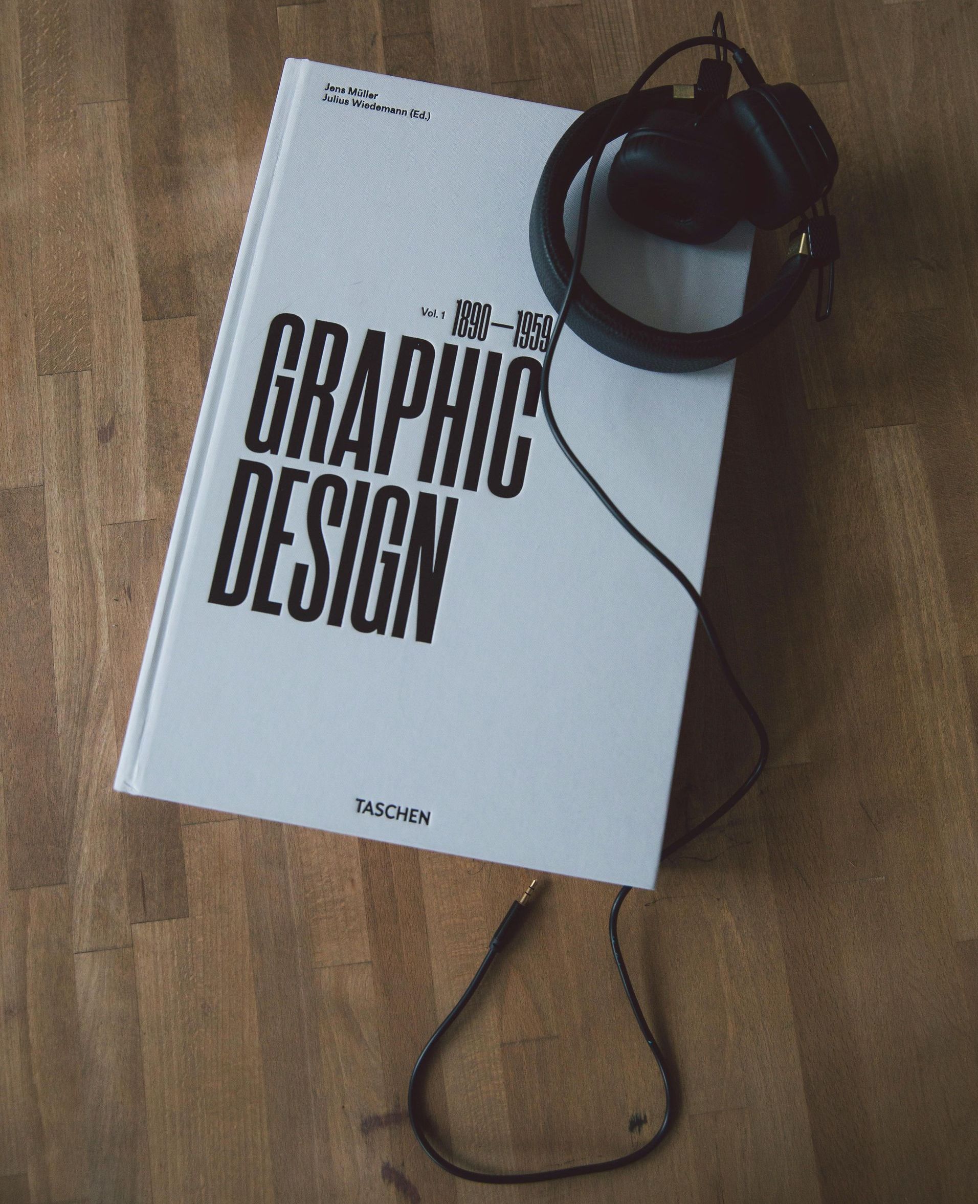 a brochure with a man shaking hands on it is sitting on a table .