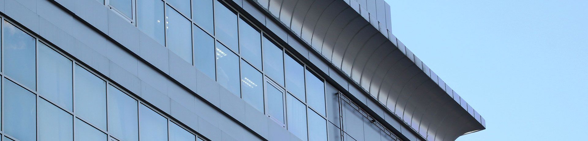 a tall building with a lot of windows against a blue sky .