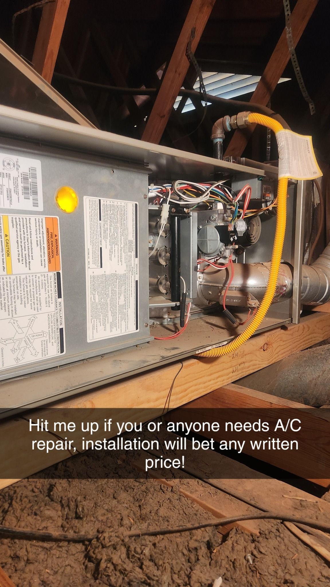 An air conditioner is sitting in the attic of a house.