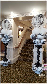 White and black balloon columns
