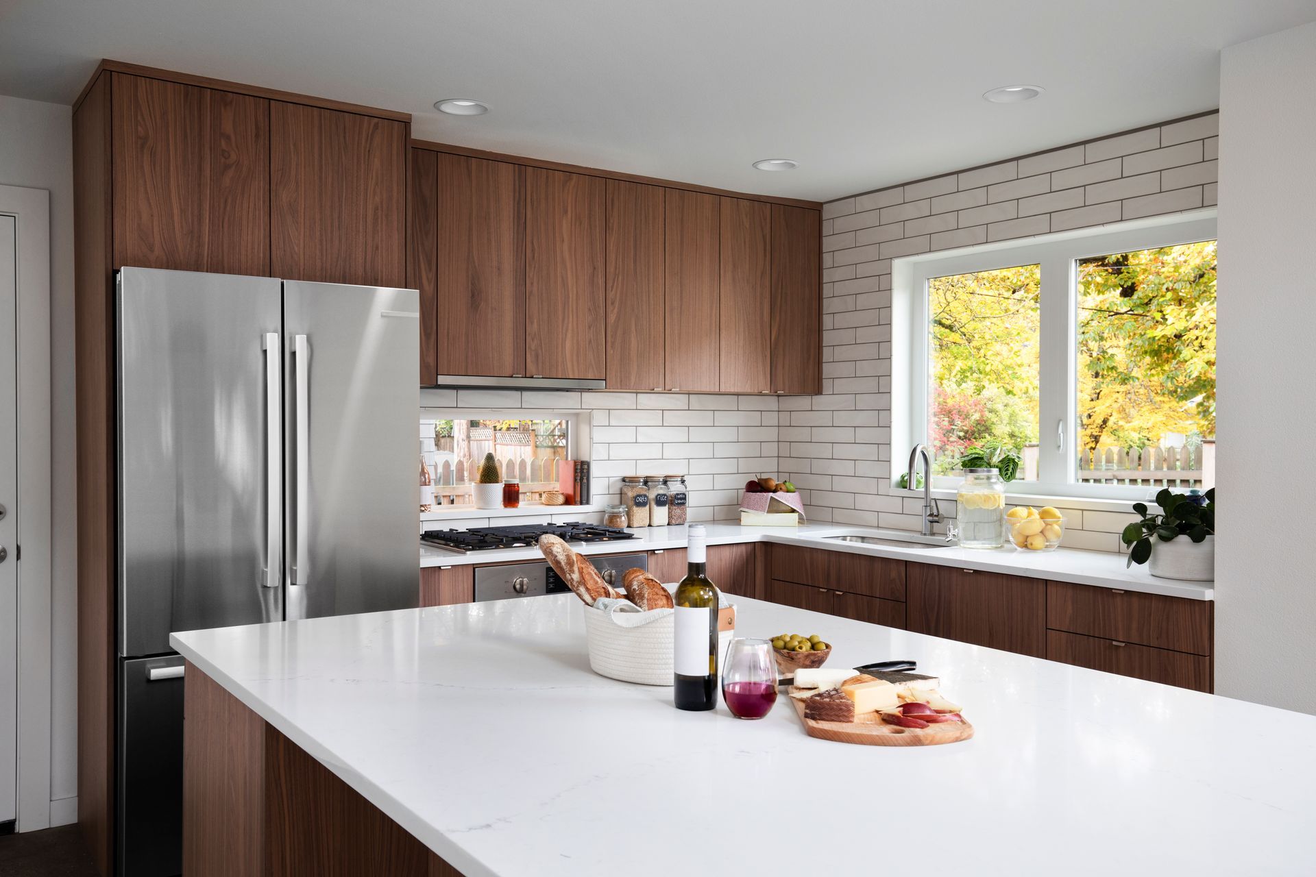 Modern Bachelor kitchen with walnut cabinets and minimalist design in Portland home