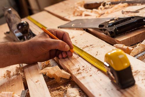 Carpenter Taking Measurement - Remodeling in Burien, WA