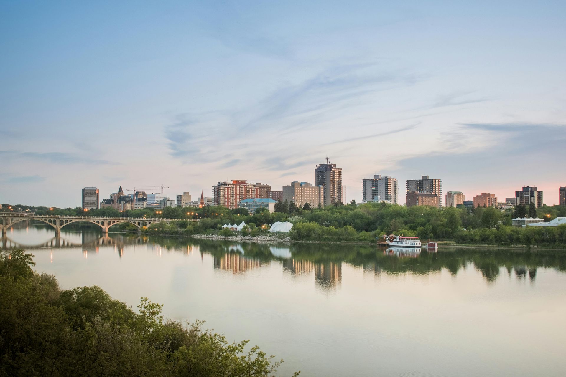 Skyline of Saskatoon, Saskatchewan, in the South Saskatchewan River. Cannabis. Weed City. Dispensary.